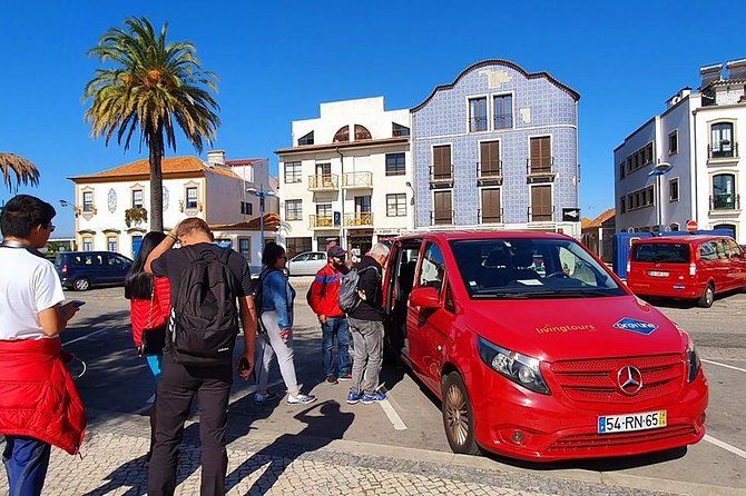 Aveiro and Costa Nova Half Day Tour from Porto with Boat Ride - Costa Nova: striped huts, beach-road photos, and quick coastal air