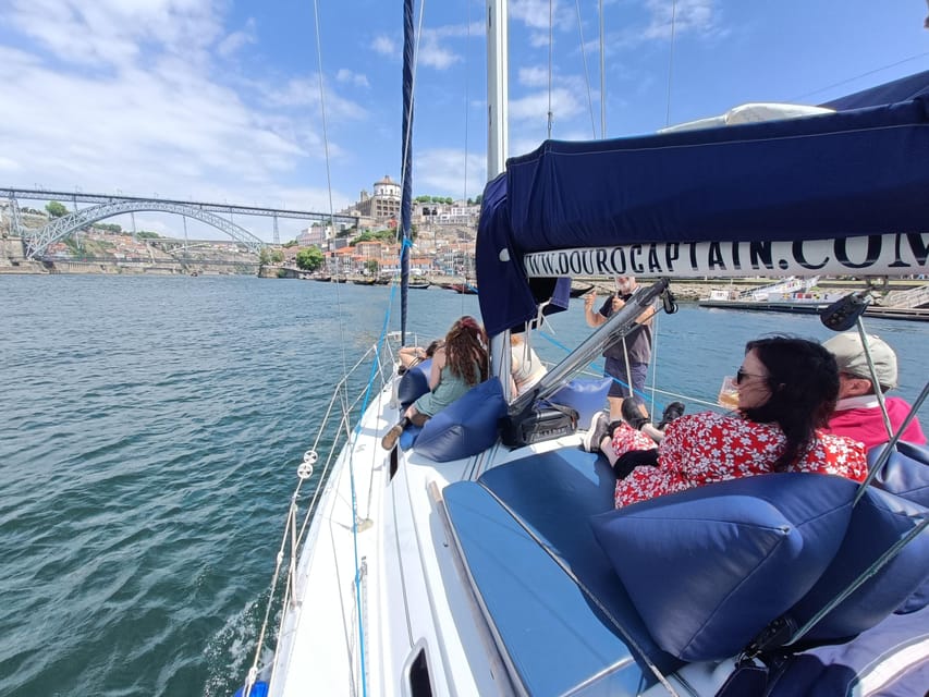 Porto: Charming Sailboat Cruise with Port Wine,Sunset Option - The Douro estuary to the Atlantic, palm trees, and dolphin luck