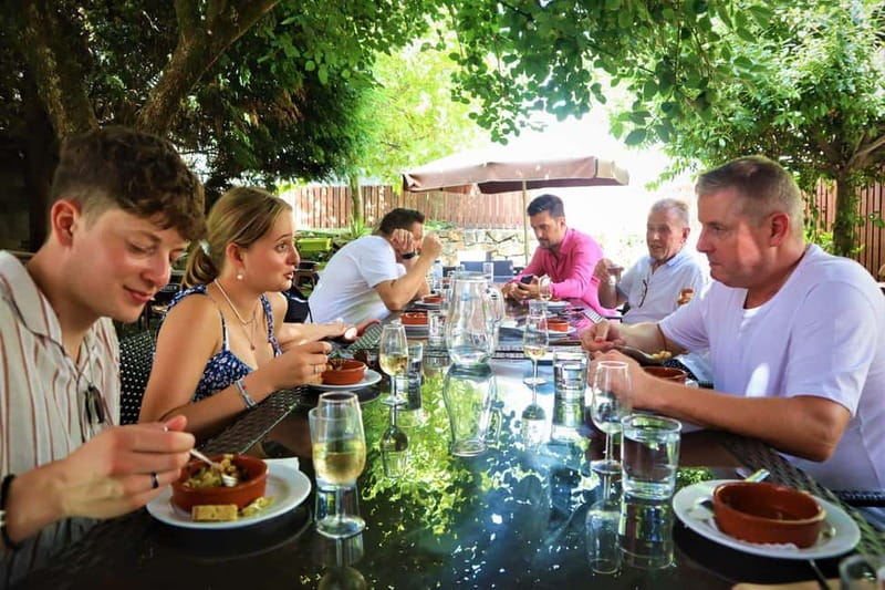Porto: Food and Wine tasting tour of Hidden Gems - A courtyard pause at Jardim do Japão, where wine and snacks share the spotlight