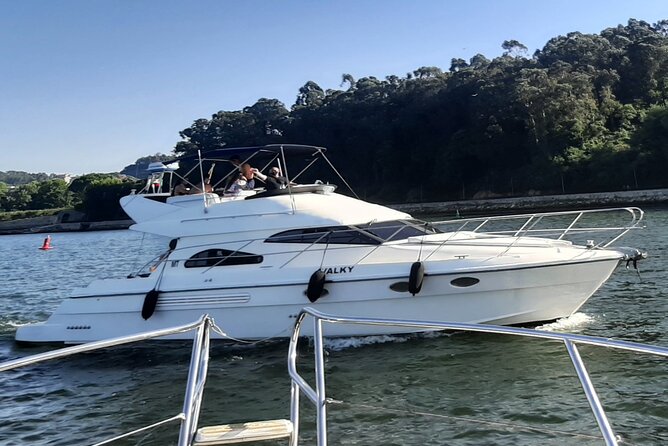 Porto: Luxury Yacht Cruise on the Douro River and Estuary Reserve - Cruising the Douro River past Porto and Gaia icons