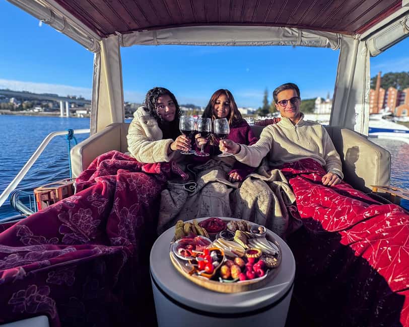 Porto: Private Douro River Cruise – 6 Bridges & Sunset - Welcome drink, local tasting board, and a Port wine toast on board