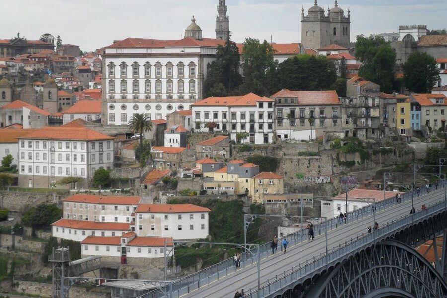 Porto Private Walking Tour with Fast Track to Lello - São Bento Station clock and azulejo stories