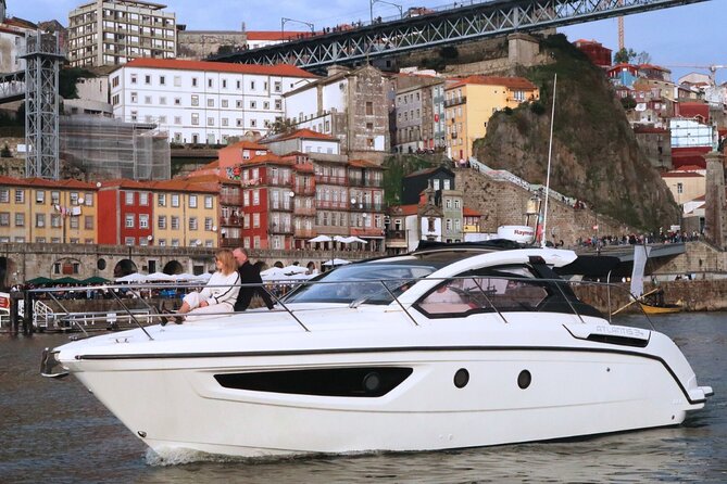 Porto: Private Yacht Experience with Local Wines & Snacks - The mouth of the port: tasting board time with the big backdrop