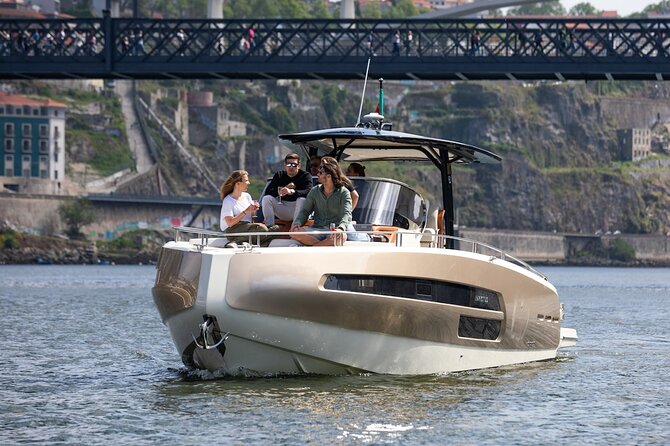 Porto Sunset Cruise on a Private Luxury Yacht in the Douro - Rabelo Boats, Ribeira to Gaia, and the Dom Luís I and Maria Pia Bridges