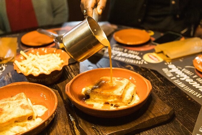 Porto Wine & Dine: Port Wine Cave Food Tour with Eating Europe - Rua Luís de Camões: Alheira History and a Savory Lesson