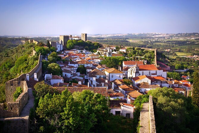 Transfer Tour Porto/Lisbon with 2 stops options Óbidos, Nazaré, Fátima, Coimbra - Comfort, language, and the value of a real guide-driver (Filipe)